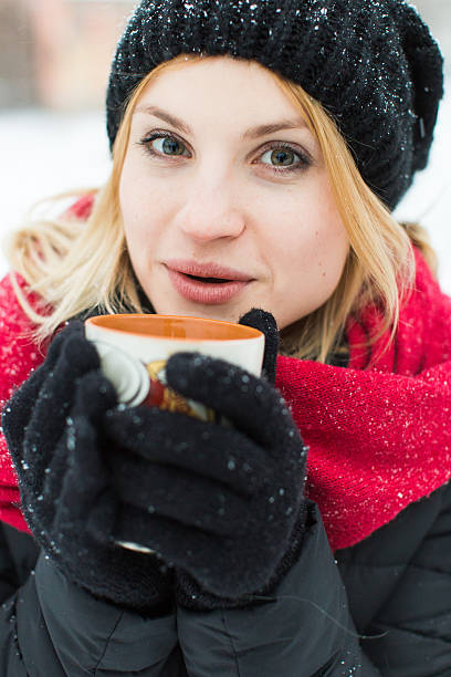 istock Winter girl drinking hot tea 505574044
