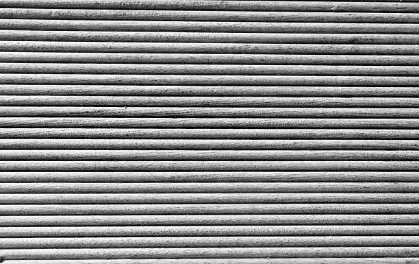 istock Wooden grooves panel in black and white 505574422