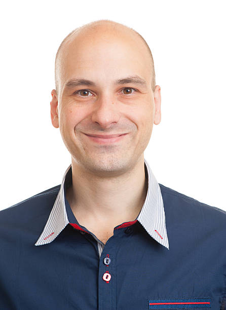 istock portrait of a smiling bald man 505576424