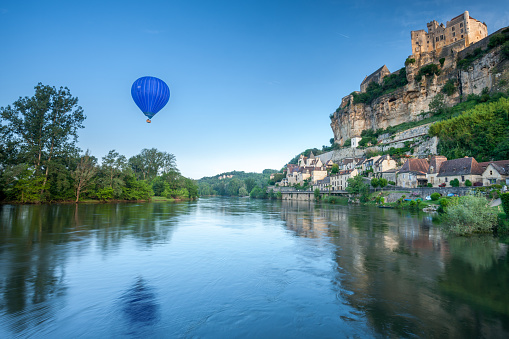 Chateau Beynac and a hot air balloon Dordogne France