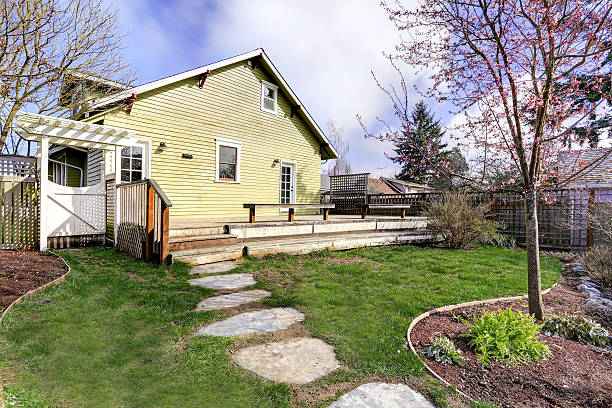 istock House backyard with walkout deck and small garden 505582123