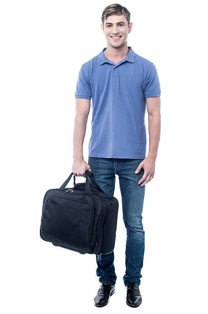 istock Smiling casual man standing with bag 505582357