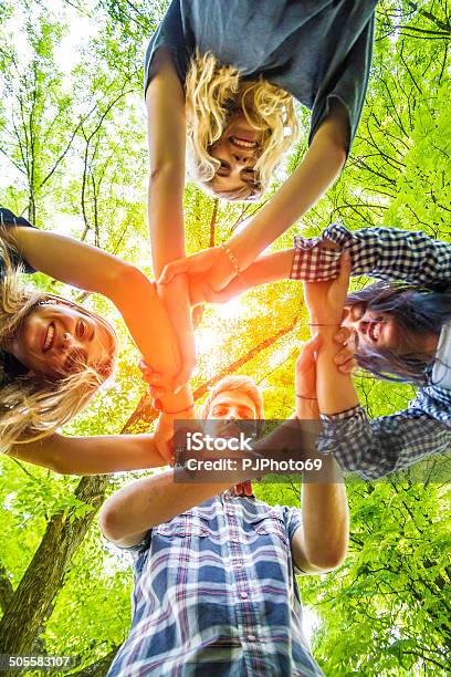 Group Of Friends With Hands In Hands Teamwork Stock Photo - Download Image Now - Summer Camp, Teenager, Camping