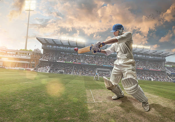 Cricket Batsman INSPECTOR PLEASE NOTE: Stadium is fake, created in Photoshop. Models are from different shoot, dates on releases a re correct - thanks.  batsman photos stock pictures, royalty-free photos & images