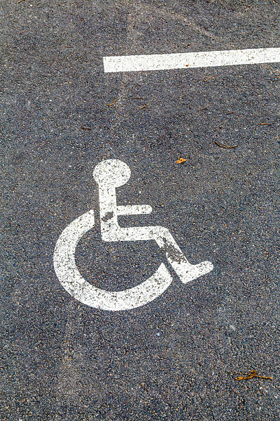 istock Disabled parking permit sign on the street 505584791