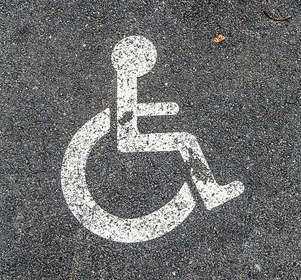 istock Disabled parking permit sign on the street 505584793