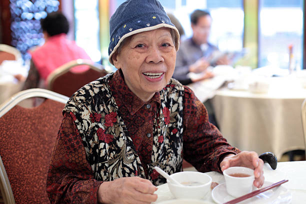 Grandmother Grandmother chinese ethnicity china restaurant eating stock pictures, royalty-free photos & images