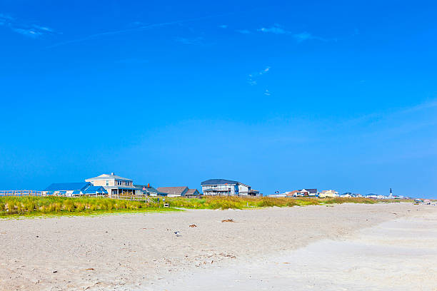istock wooden houses at the empty beach 505587283