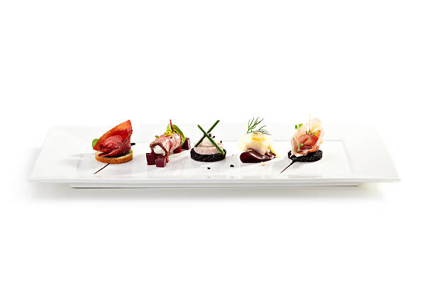 Canapes Meat Canapes on White Dish canape stock pictures, royalty-free photos & images
