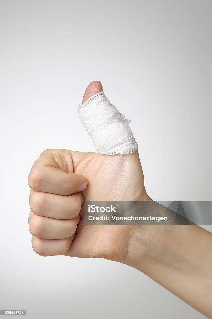 Injured thumb with bandage Injured painful thumb with white bandage Bandage Stock Photo