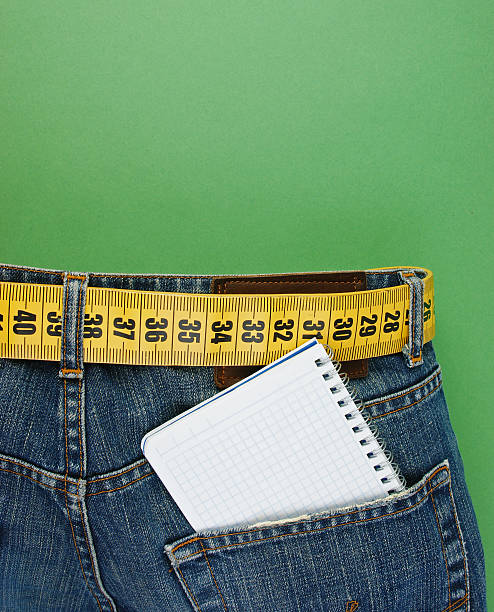 istock jeans with meter belt slimming and notebook in pocket 505587985