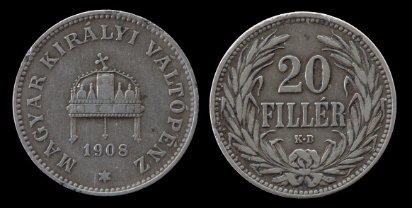 Twenty Hungarian fillers coin of 1908 year isolated on black background. The Obverse and Reverse