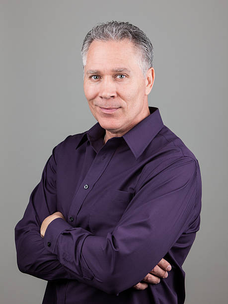 istock Serious attractive middle age man with arms crossed 505592414