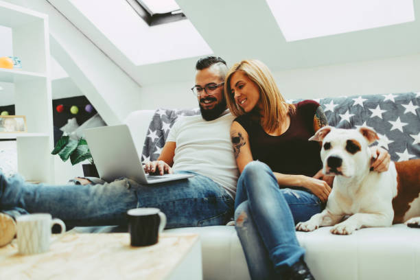 istock Couple with their dog at home 505593262