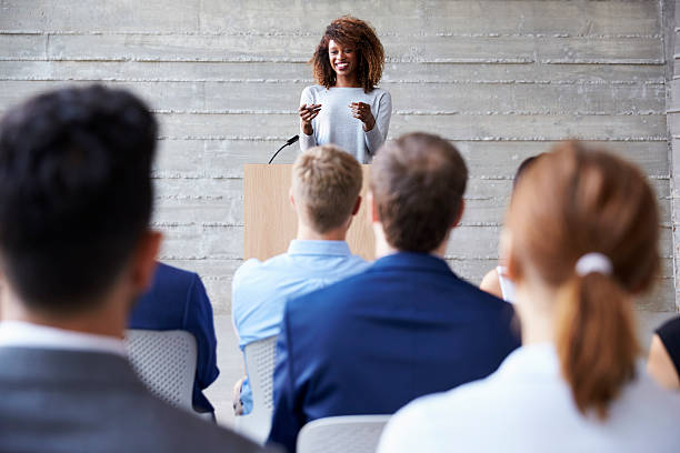 istock Businesswoman Addressing Delegates At Conference 505595256