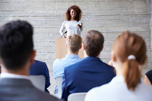 istock Businesswoman Addressing Delegates At Conference 505595358