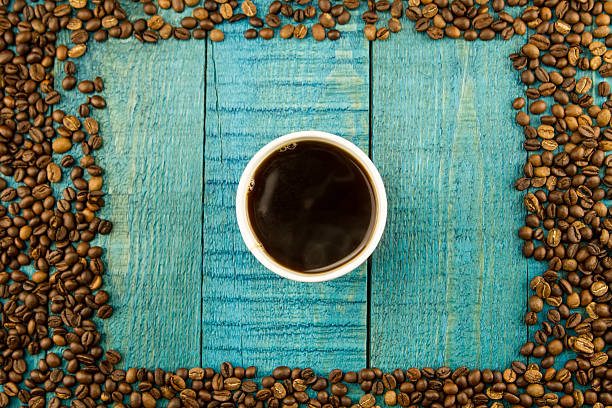 istock coffee Cup and beans on a blue wooden background 505595948