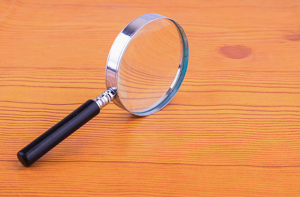 istock Magnifying glass in a metal frame with rubber black handle 505597798