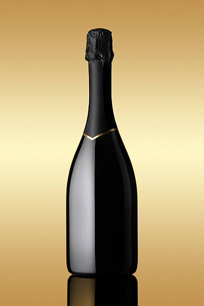 bottle of sparkling wine on gold background