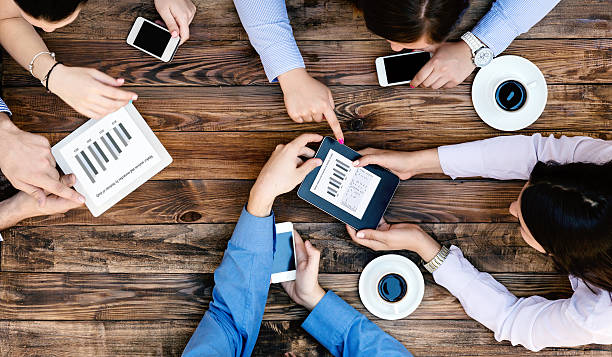 istock From above View of Business Team with Gadgets interacting 505598260