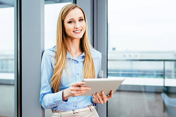 istock Attractive manager with a tablet in her hands 505598536