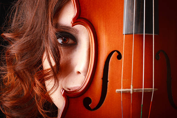 istock girl with violin 505599121