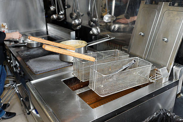 istock Deep fryers with boiling oil on kitchen 505599677