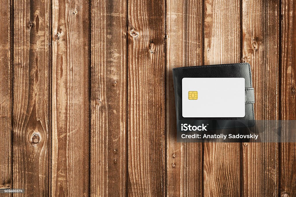 Wallet and credit card on wooden table Banking Stock Photo