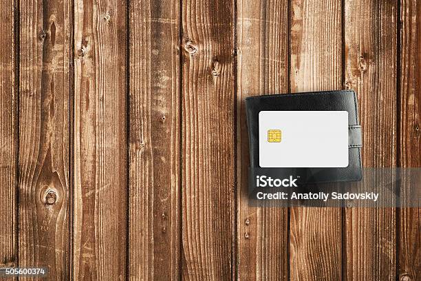 Wallet And Credit Card On Wooden Table Stock Photo - Download Image Now - Banking, Black Color, Business Finance and Industry