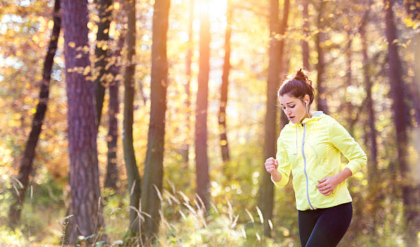istock Young woman running 505600468