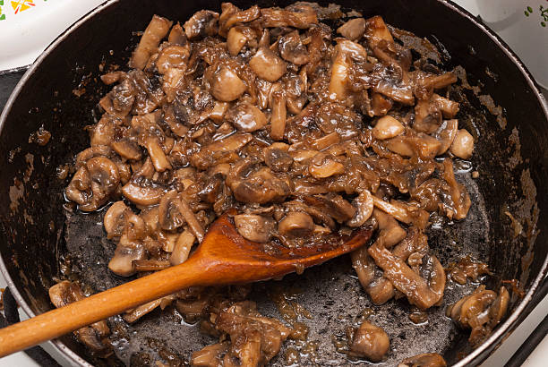 istock fried mushrooms in a pan 505601720