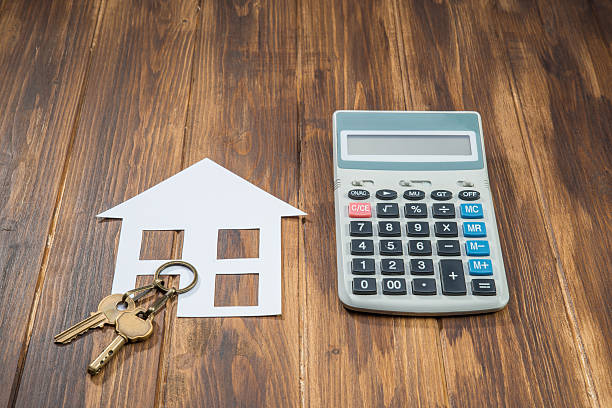 istock Mortgage Calculator, house and key with Calculator 505602786