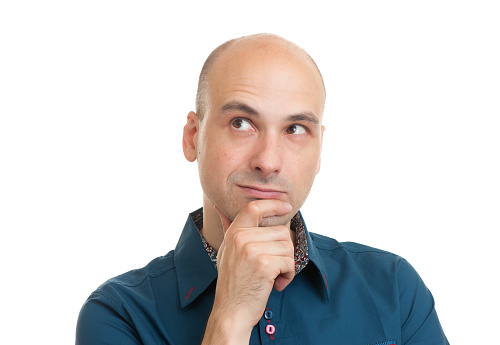 handsome bald man thinking isolated on white background