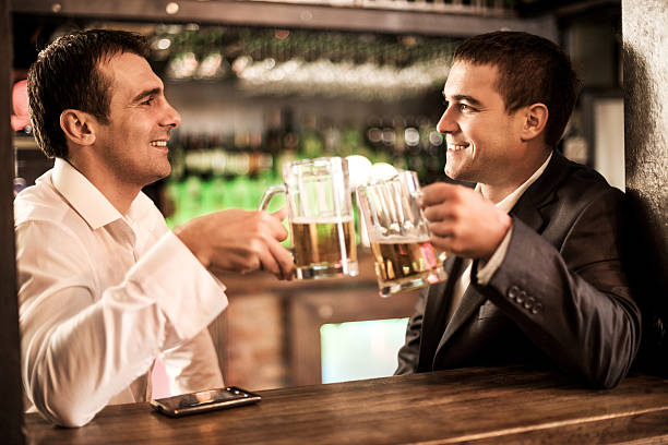 istock Smiling businessmen toasting with beer. 505604095