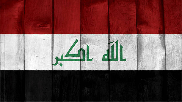 istock iraq Flag on the wood texture 505604215