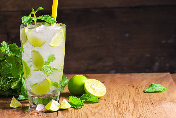 istock Mojito , lime pieces , leaves of mint with ice and rum 505604435