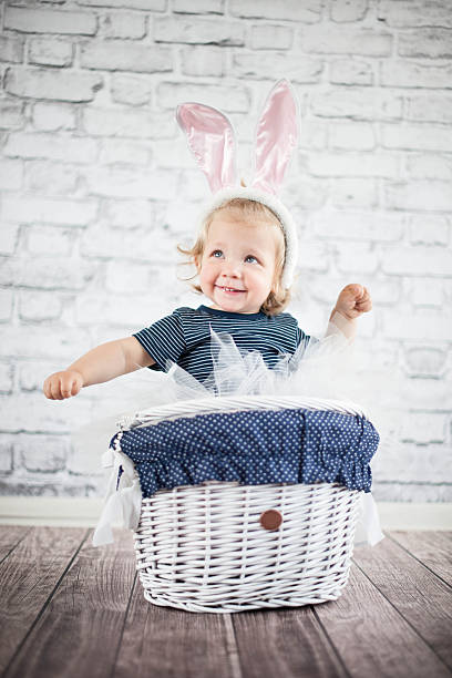 istock Cute baby bunny in the baske 505616333
