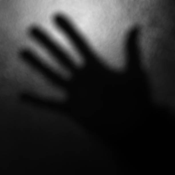 istock Blurred black and white background with one hand 505617798