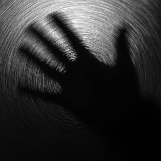istock Blurred black and white background with one hand 505617838