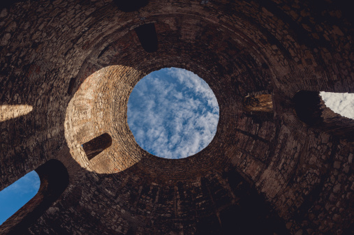 Vestibule of Diocletian's Palace in Split, Croatia. view from the bottom with a portion of blue sky.