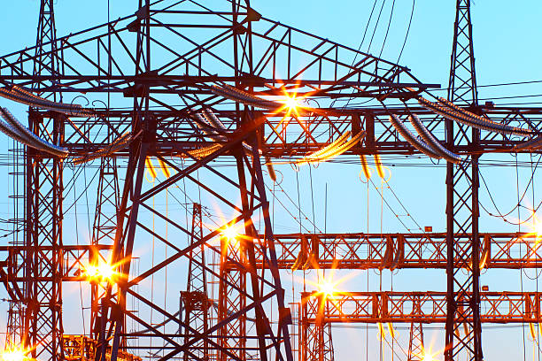 電気 substation ナイトタイムの光の - industrial equipment industry growth silhouette ストックフォトと画像