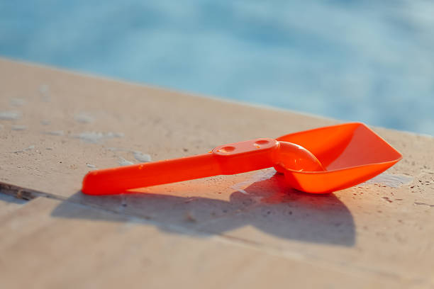 istock Plastic shovel on pool edge 505623231