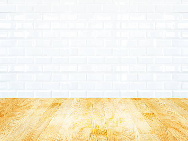istock White brick tile wall and wood parquet floor 505623313