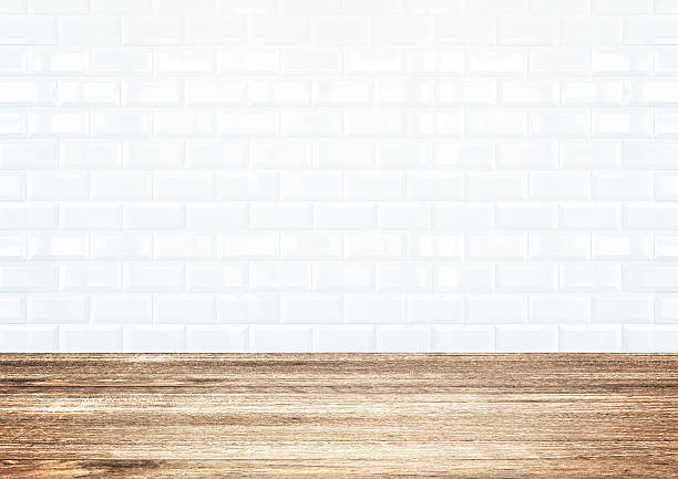 istock White brick tile wall and wood plank floor 505623319