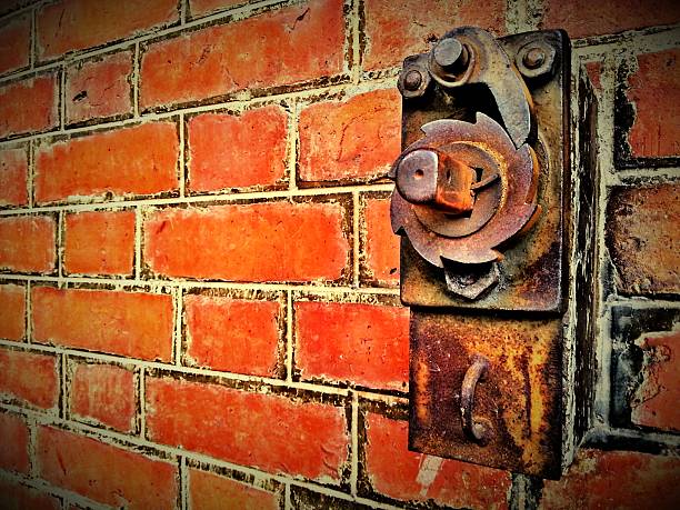 istock Red brick wall with door control lock 505623663
