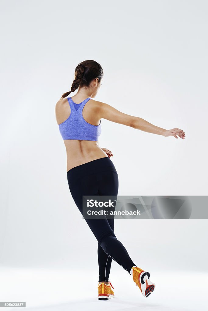 Just go with it Rearview shot of an attractive young woman doing an aerobic dance workout 20-29 Years Stock Photo