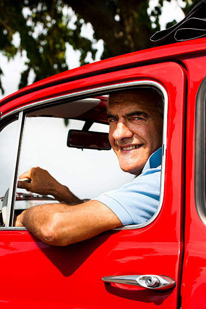 istock Senior Man In Vintage Car 505623911