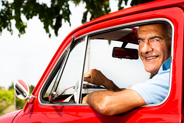 istock Senior Man In Vintage Car 505623929