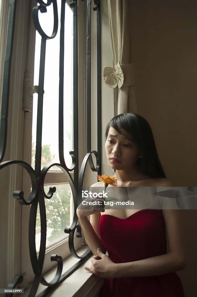 Young Asian Young Asian lady looking disappointed and waiting for her lover. Adult Stock Photo