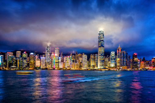 Hong Kong financial district at twilight, Victoria Harbour, Hong Kong Island.